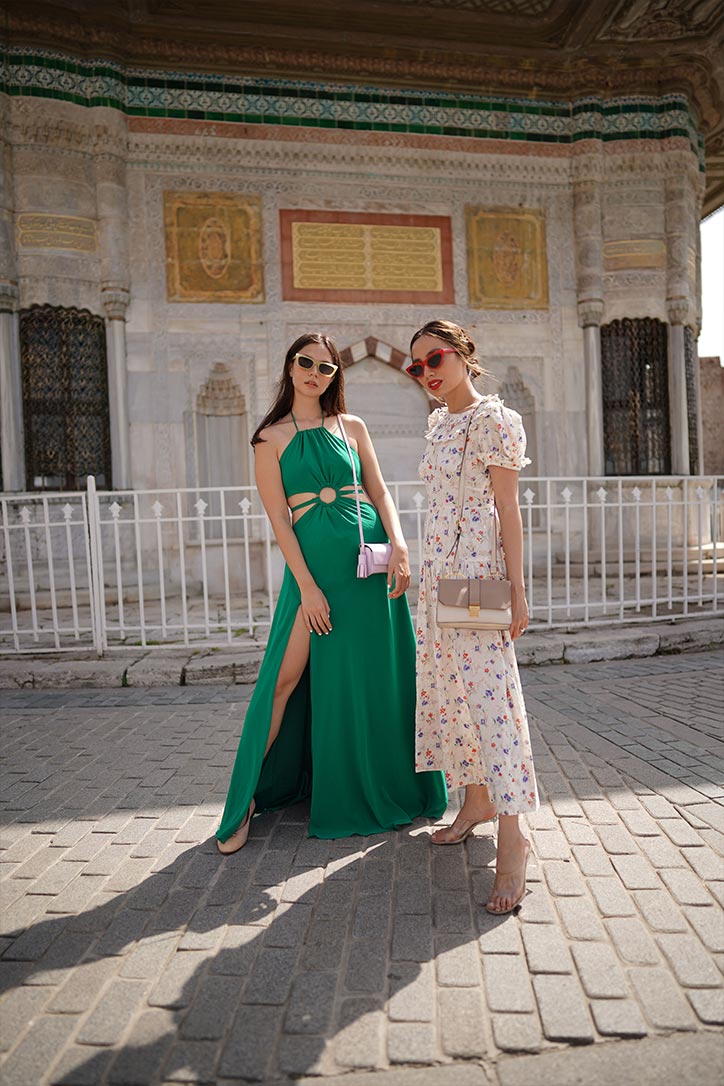 Jess Wilson and Martine Cajucom-Ho standing in front of Topkapi Palace, one of the five best OOTD spots in Istanbul 