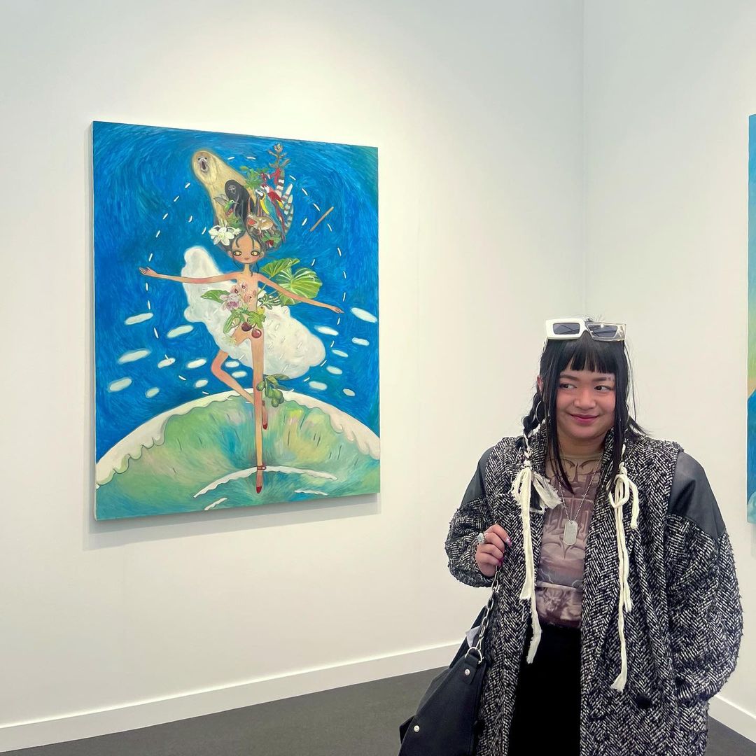Aria Clemente with her artwork