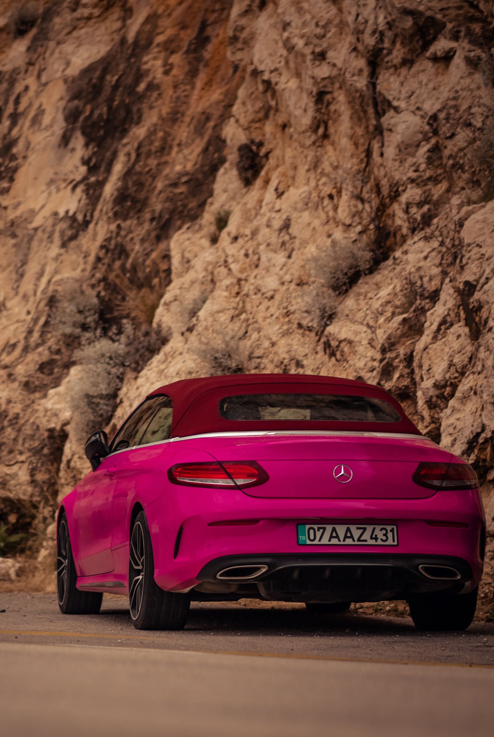 pink cars on the road