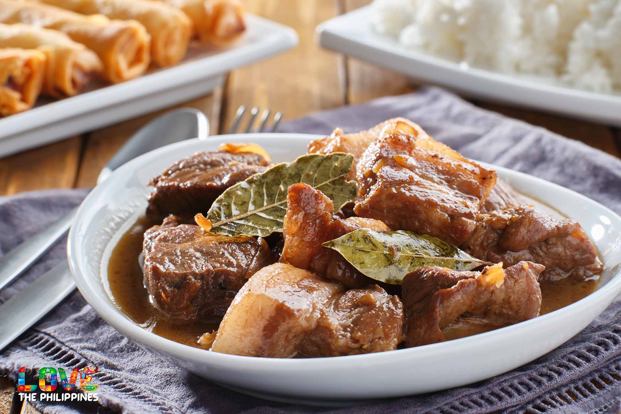 Pork Adobo is made with succulent pork belly braised in vinegar, soy sauce, garlic, and onions.