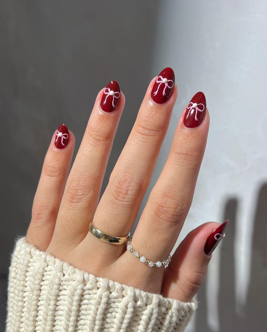 Coquette red nails with ribbon details