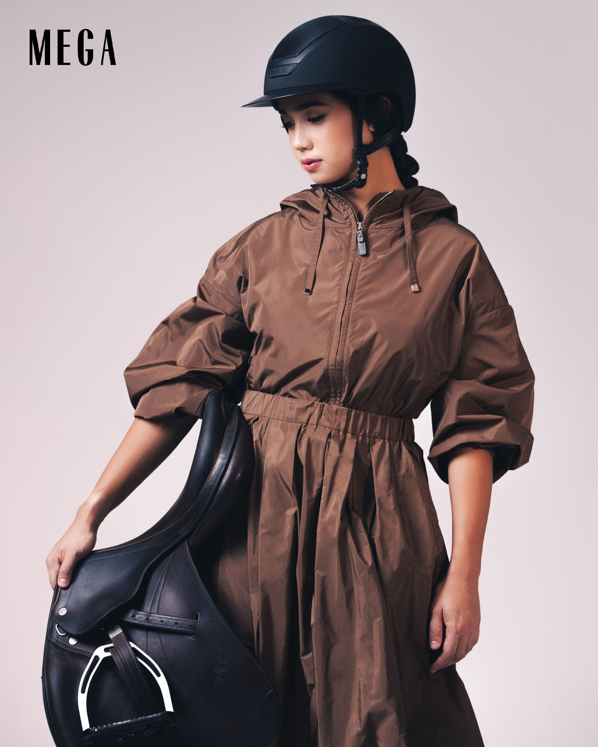 A fashionable twist to her equestrian essentials, Lorenzo wears a MAX MARA top and skirt