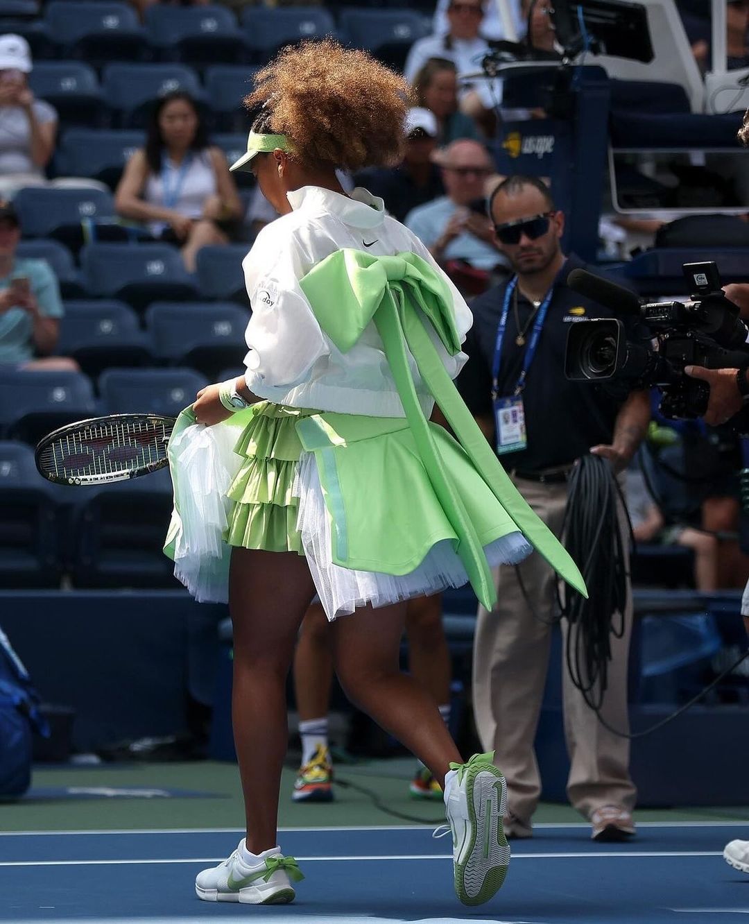 Naomi Osaka incorporated tiered tulle, brat neon green, and bows for her U.S. Open look courtesy of Yoo Ahn’s Ambush