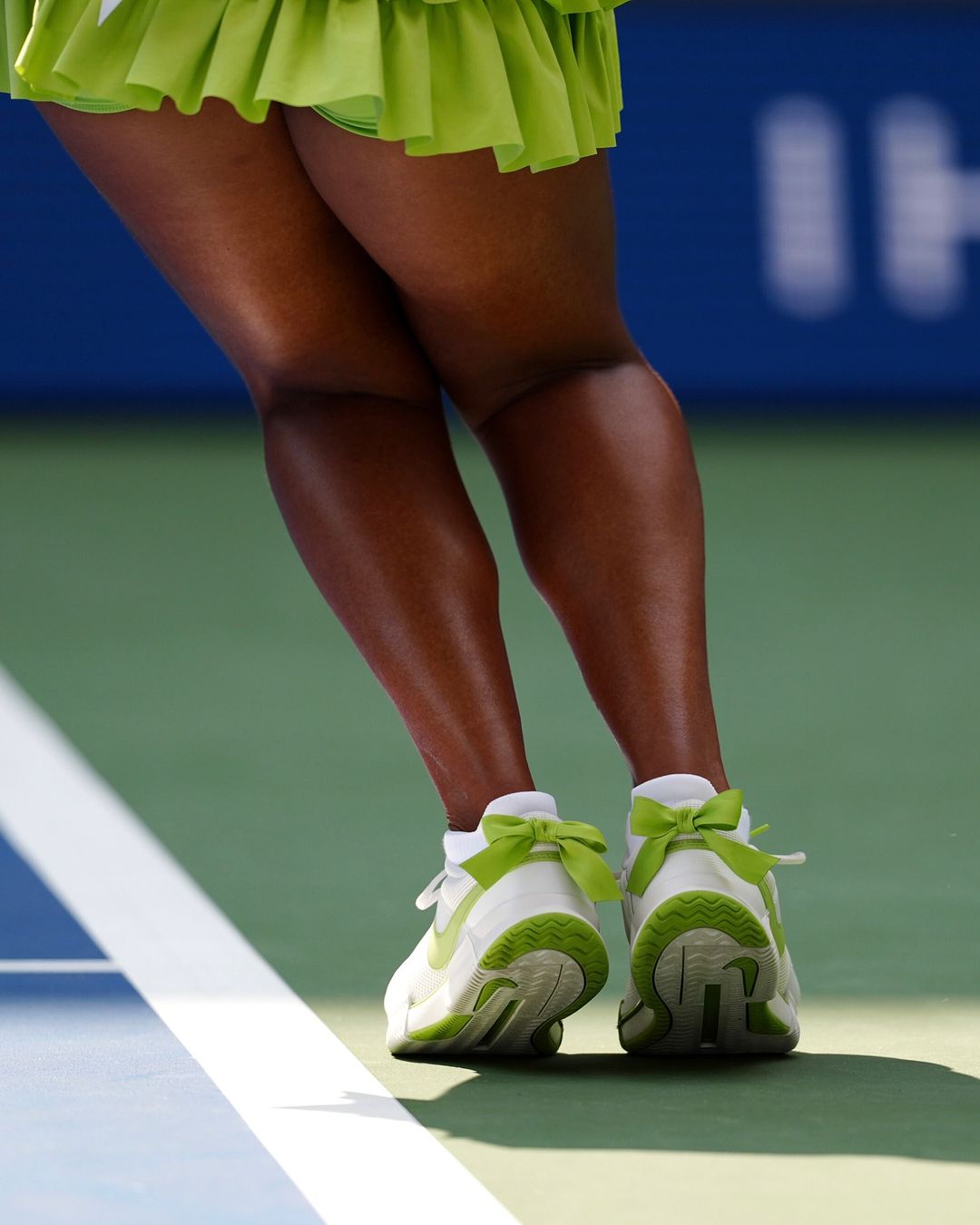 Naomi Osaka dons a bowed green pair of Nike shoes