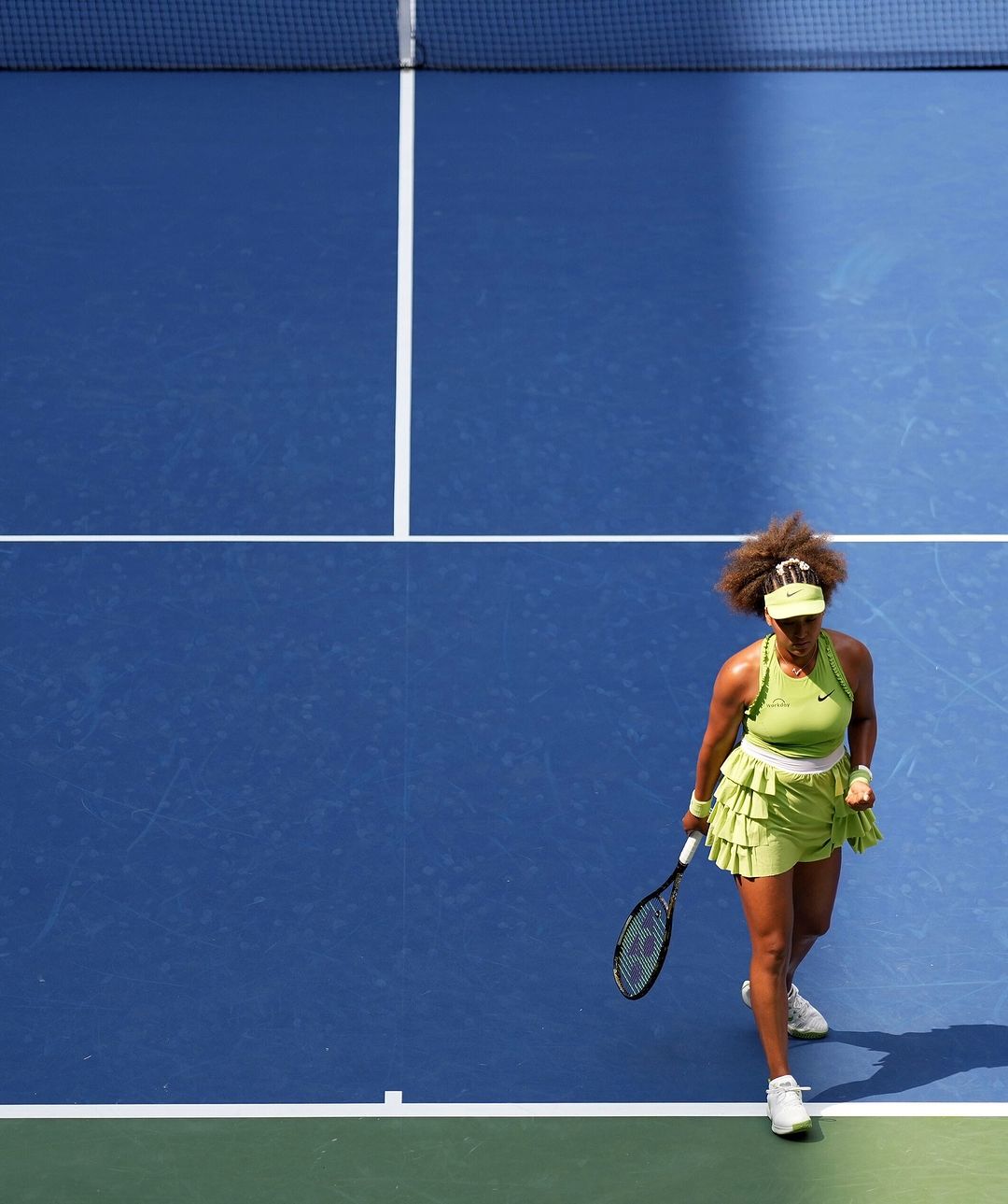 How to stand out in court? Naomi Osaka does this through ruffles and a bright green shade.