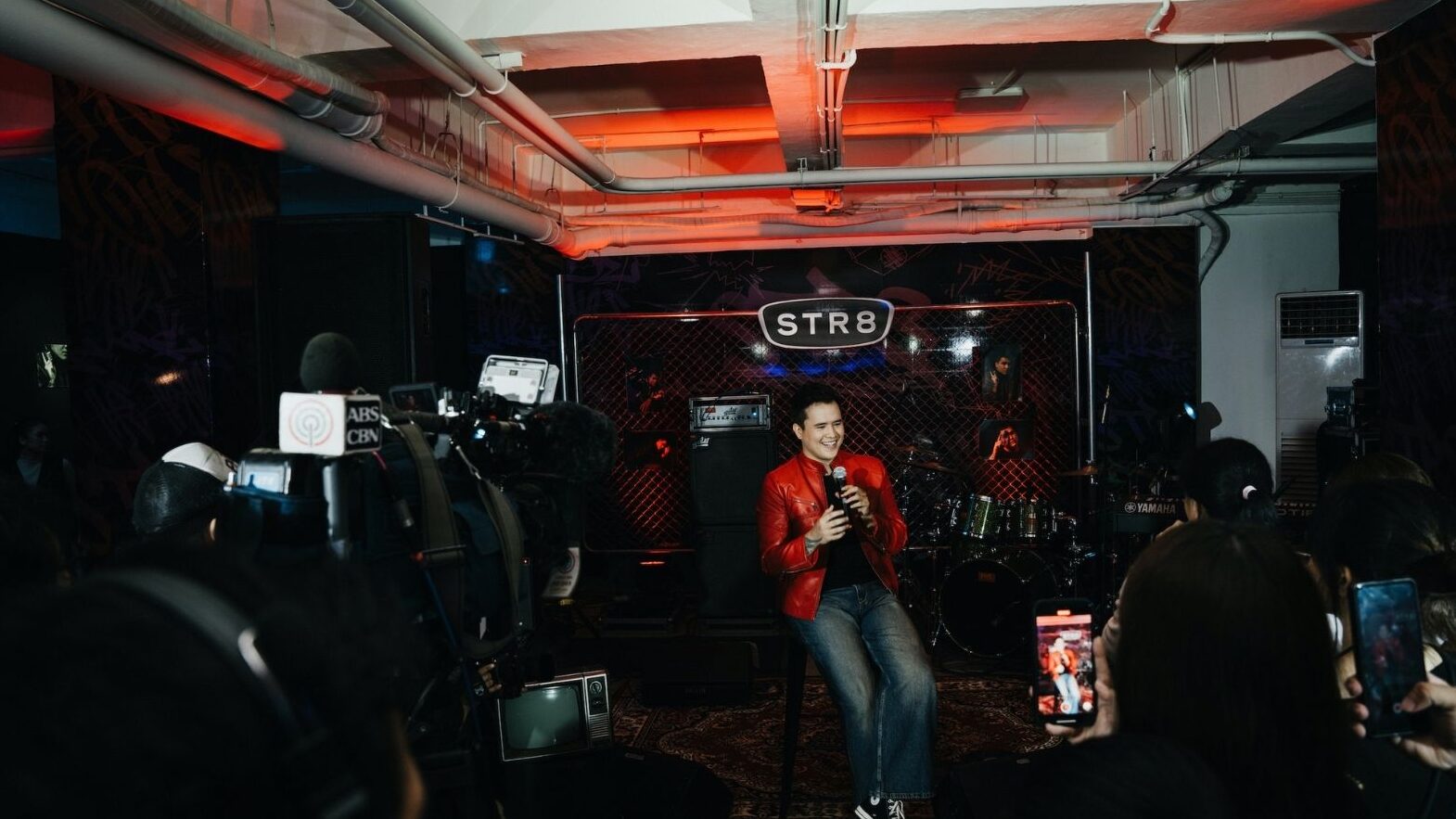 Juan Karlos infront of Media for STR8