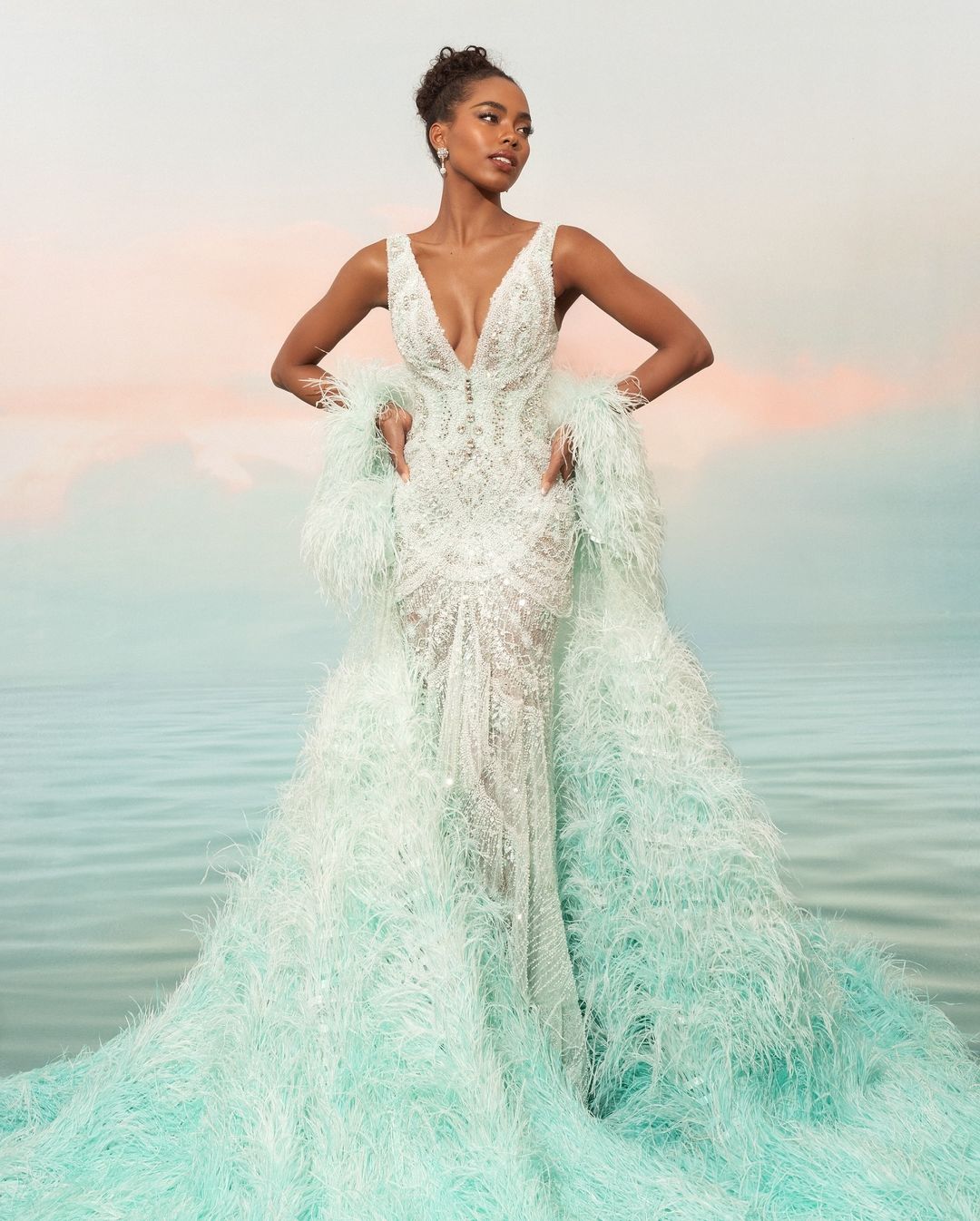 Miss universe 2024 Chelsea Manalo evening gown Tiffany blue feathered manny halasan