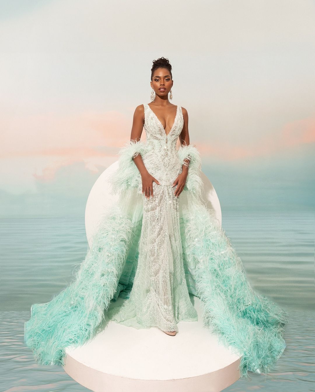 Miss universe 2024 Chelsea Manalo evening gown Tiffany blue feathered manny halasan