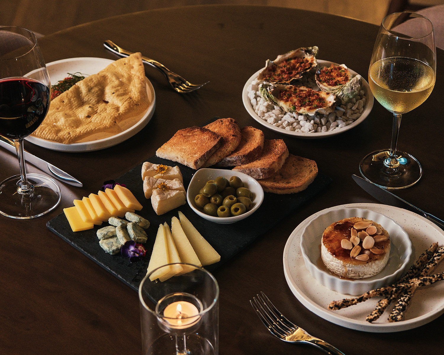 Feast your eyes and stomachs with a Cheese Board, Baked Camembert, Oysters Au Gratin, Watermelon Tartare, and pair them with your choice of wine Project Vino Reserve food wine restaurant Christmas holidays