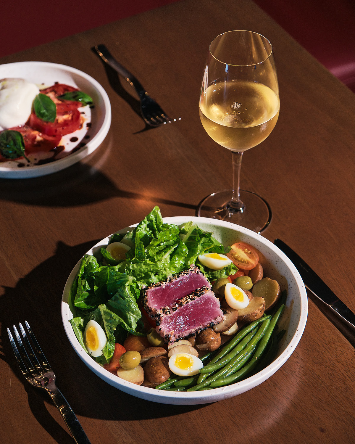 Salad Niçoise paired with a glass of white wine Project Vino Reserve food wine restaurant Christmas holidays